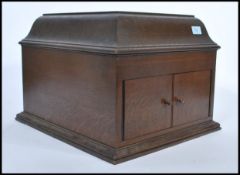 An early 20th Century HMV oak cased table top gramophone having good case with hinged top opening to