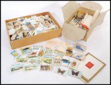 A collection of vintage cigarette and tea cards dating from the first half of the 20th Century to