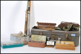 A collection of vintage 20th century fishing gear and equipments to include carry, old split cane