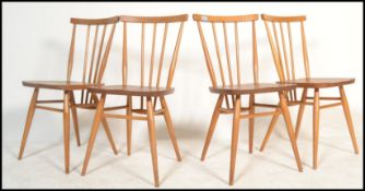 A set of four vintage retro 20th century Ercol beech and elm Windsor model 391 dining chairs