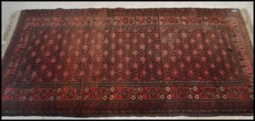 An early 20th century Persian rug  hanging having red ground with geometric decoration. ( reduced in