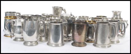 A selection of sporting interest rowing related white metal tankards and goblets, most made from