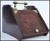 A 19th century Victorian mahogany coal scuttle box retaining the original tin liner. The fall