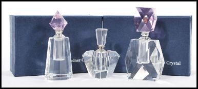 A group of three vintage 20th century Art Deco influence faceted glass perfume bottles having