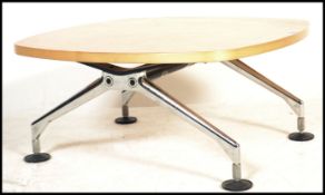 A contemporary / 20th century chrome and maple wood coffee occasional table by Vitra. Raised on