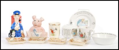A collection of Royal Doulton Beatrix Potter ceramics to include plates, bowl, money box, a