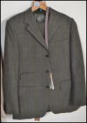 A vintage mid 20th Century Dunn and Co gentleman's tweed / check two piece suit in fantastic