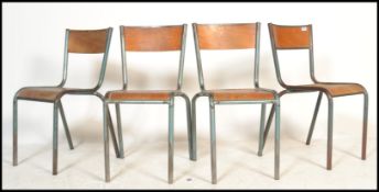 A set of 4 mid 20th century retro tubular metal and plywood stacking chairs - dining chairs of
