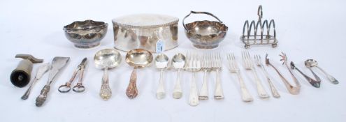 A collection of silver plated wares to include lozenge shaped box, grape scissors, toast rack,