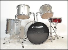 A 20th century / contemporary Ludwig Drum set comprising of the base drum, snare drum, pedals and