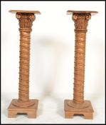 A pair of 20th Century carved wooden bust / jardiniere stands  in the form of composite spiral