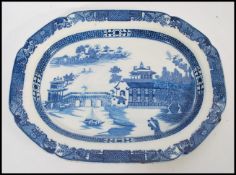 A 19th century Chinese blue and white meat platter tray plate having typical decoration depicting