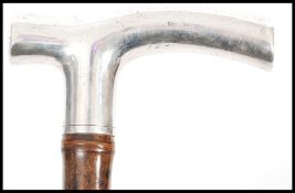 A 19th century Victorian silver hallmarked promenade cane having a shaped silver hallmarked handle