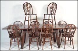 A 20th Century french stained oak draw leaf dining table raised on turned angular supports, together