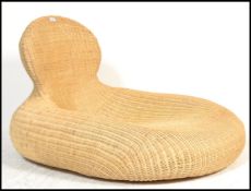 A 20th century unusual contemporary wicker oversized chaise longue day bed of pebble form with
