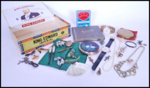 A selection of vintage costume jewellery items to include a silver hallmarked 1918 ribbon brooch