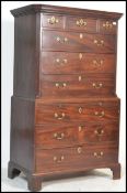 A 19th century Georgian bachelors mahogany chest on chest of drawers - tallboy. Raised on shaped