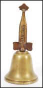 A vintage 20th century advertising countertop bell for Schweppes and Co with brass finial handle.