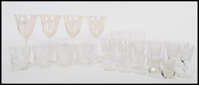 A collection of Edinburgh cut glass crystal glasses, together with a set of four wine glasses