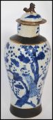 An early 20th century Chinese crackle glazed vase having hand painted blue and white decoration