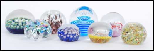 A selection of 20th Century glass domed paperweights to include millefiori, control bubble, spiral