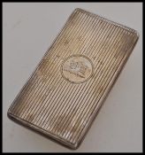 A silver hallmarked sprung calling card case, machine turned case with central cartouche having a