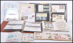 A collection of mostly GB post decimal stamps and FDCs in albums with some earlier examples.