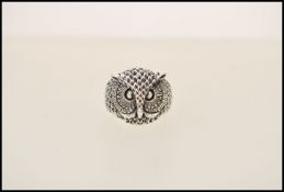 A stamped 925 silver ring inthe form of an owl. Weight approx 8.2g. Size P.5.
