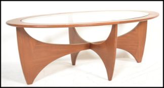 A retro mid 20th century teak wood atomic ' Astro ' lozenge shaped coffee table by G Plan, having