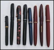 A collection of vintage 20th Century assorted fountain pens, each fitted with a nib marked 14K, to