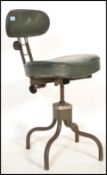 A vintage retro 20th century industrial factory machinists stool chair by Evertaut raised on