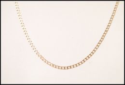 A stamped 375 9gt gold flat linked chain necklace with a lobster clasp. Weight 5.6g.