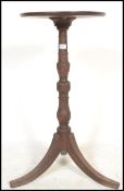 An 18th century George III mahogany wine table. Of tripod form with splayed legs, turned column