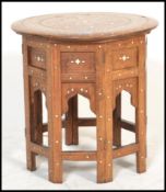 A believed early 20th century Moorish hardwood inlaid Binares traders table of octagonal form with