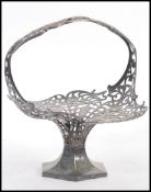 A stunning silver plated early 20th Century centre piece / flower basket, floral fret work design