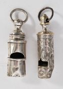 Two silver hallmarked / silver plated whistles the plated one having engraved Rococo swirls and