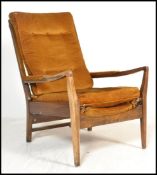 A vintage mid 20th Century open armed fireside beech armchair / elbow chair by Cintique, Raised on