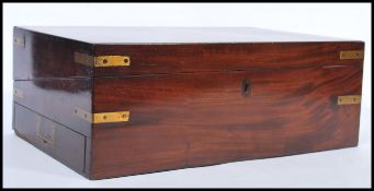 A large Georgian 19th century mahogany and brass bound large writing slope with fully appointed