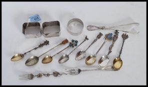 A selection of silver and silver plated items to include a Birmingham hallmarked round napkin