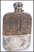 A silver hallmarked and snake skin gentleman's hip flask.