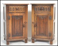 A pair of 20th Century Jaycee oak bedside cabinets in the linen fold pattern, single drawer above
