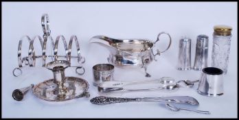 A collection of silver plated items to include a Martin Hall & Co silver plated creamer jug on pad