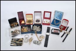 A collection of vintage retro costume jewellery, consisting of watches, necklaces, brooches, tie