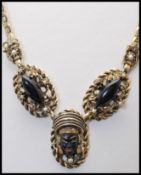 A 1950s Selro Selini black Asian princess necklace and brooch pin set decorated with thermoset