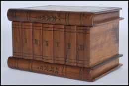 A 20th Century Sorrento ware wooden puzzle box in the form of a bookshelf with a classical scene