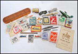 A collection of vintage items to include vintage playing cards, Diecast play worn vehicles,