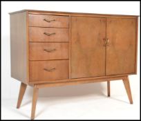 A vintage mid 20th Century walnut sideboard / credenza, having a central bank of three drawers