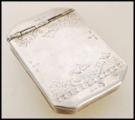 A silver white metal powder pot of elongated octagonal from having a hinged lid with engraved