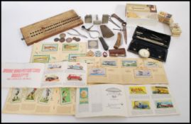 A dealers lot to include a Neolithic stone axehead, a Post & Spook Anker pocket watch, Polo lighter,