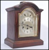 A 20th century Junghans bracket clock with westminster chime action having silvered dial with